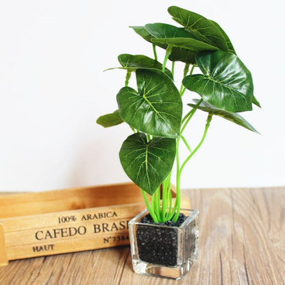 A compact flowerpot in a glass vase